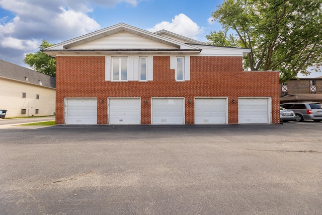5721 Circle Dr Unit 202, Oak Lawn, IL 60453 - view of home's exterior featuring community garages and brick siding