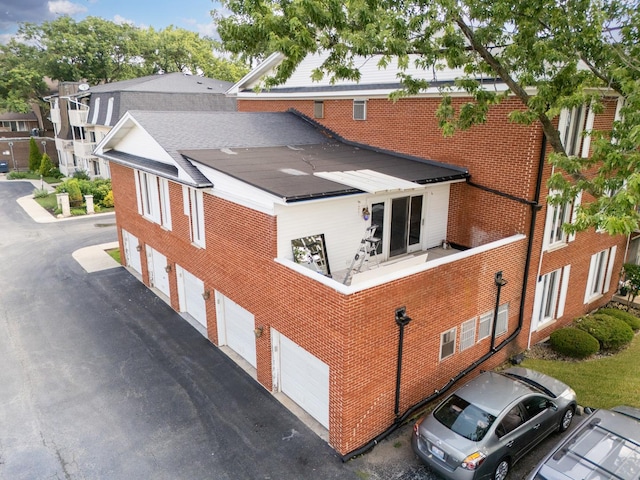 5721 Circle Dr Unit 202, Oak Lawn, IL 60453 - view of building exterior with asphalt driveway and an attached garage