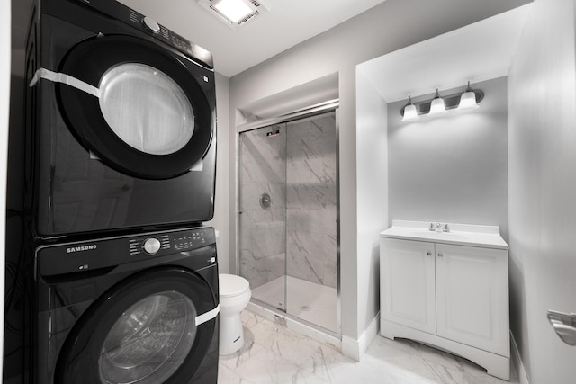 5721 Circle Dr Unit 202, Oak Lawn, IL 60453 - bathroom with stacked washer and clothes dryer, marble look tile flooring, a shower stall, and vanity