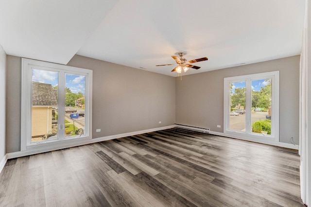5721 Circle Dr Unit 202, Oak Lawn, IL 60453 - spare room with a baseboard radiator, plenty of natural light, wood finished floors, and ceiling fan