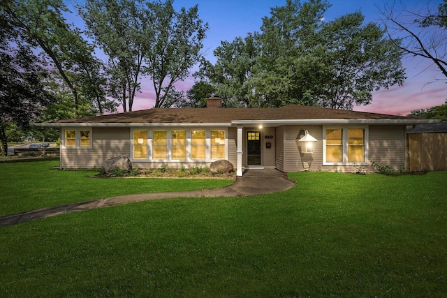230 Mantua St, Park Forest, IL 60466 - view of front of property featuring a chimney and a yard