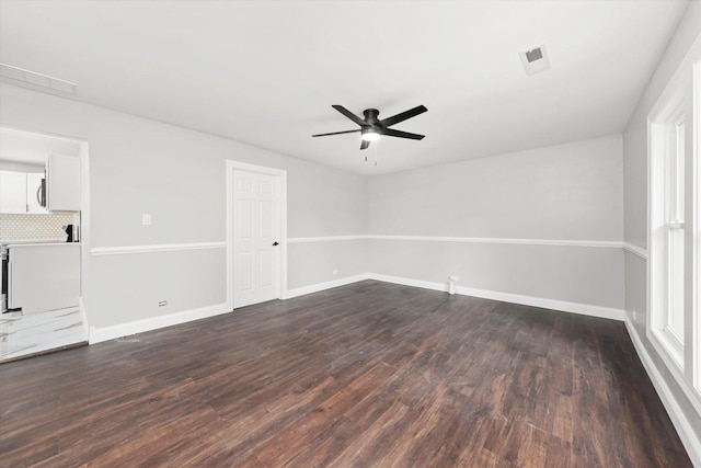 230 Mantua St, Park Forest, IL 60466 - empty room with a ceiling fan and dark wood-type flooring