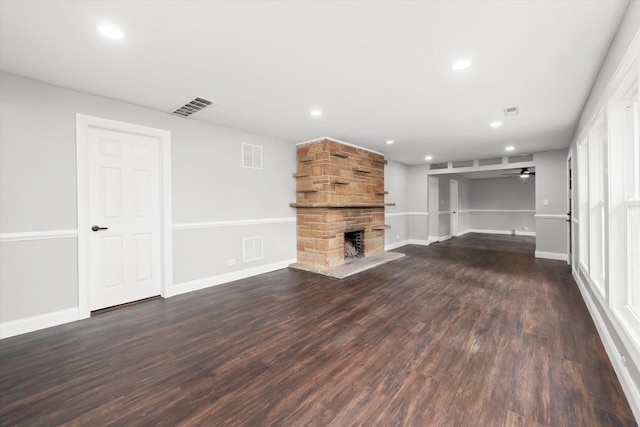 230 Mantua St, Park Forest, IL 60466 - unfurnished living room with wood finished floors, a stone fireplace, recessed lighting, and a ceiling fan