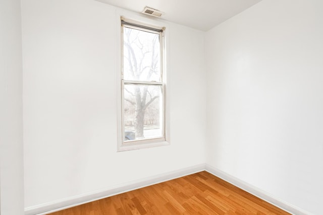 7523 S Kimbark Ave, Chicago, IL 60619 - unfurnished room with plenty of natural light and light wood-style floors
