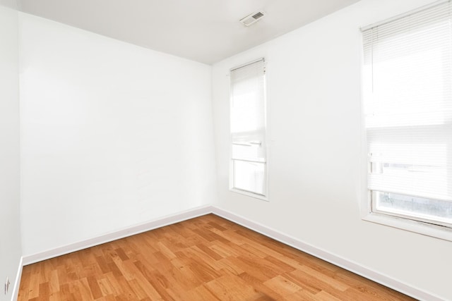 7523 S Kimbark Ave, Chicago, IL 60619 - empty room with light wood finished floors and healthy amount of natural light