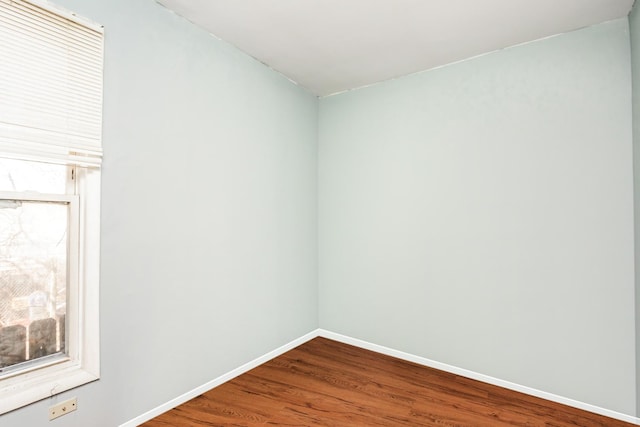7523 S Kimbark Ave, Chicago, IL 60619 - empty room with wood finished floors and baseboards