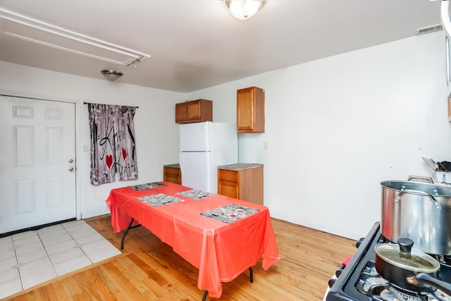 7523 S Kimbark Ave, Chicago, IL 60619 - dining space featuring attic access and light wood-style floors