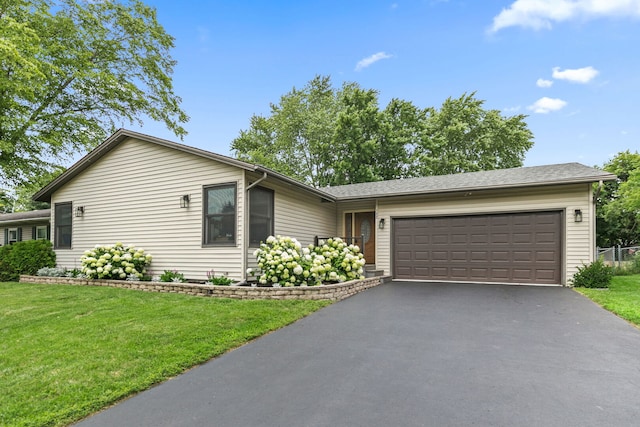 588 Arthur Dr, Cary, IL 60013 - ranch-style house featuring driveway, a garage, and a front lawn