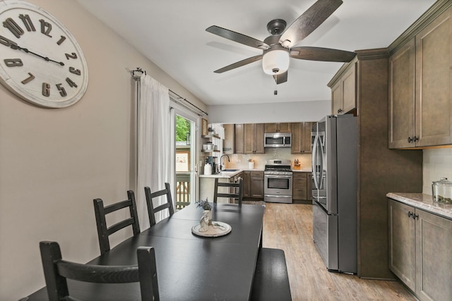 588 Arthur Dr, Cary, IL 60013 - dining room featuring ceiling fan and light wood finished floors