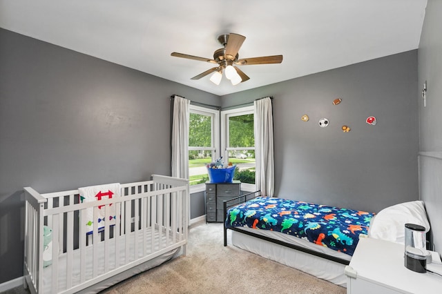 588 Arthur Dr, Cary, IL 60013 - carpeted bedroom with ceiling fan and baseboards