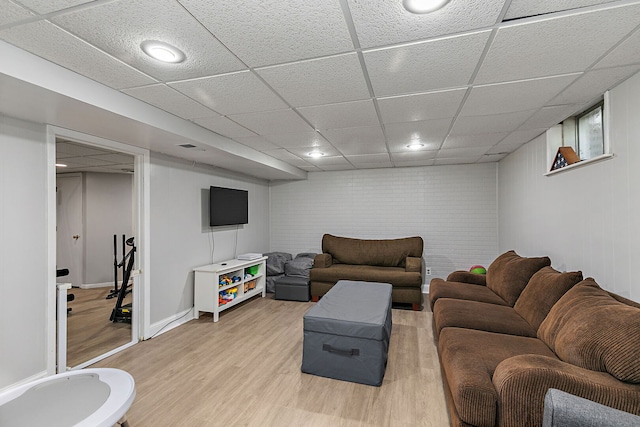 588 Arthur Dr, Cary, IL 60013 - living area with light wood-style floors and a drop ceiling