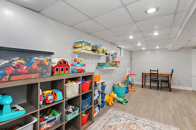 588 Arthur Dr, Cary, IL 60013 - rec room with wood finished floors, a paneled ceiling, and recessed lighting