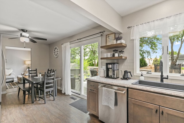 588 Arthur Dr, Cary, IL 60013 - kitchen featuring dishwasher, a ceiling fan, light wood-style flooring, light countertops, and open shelves