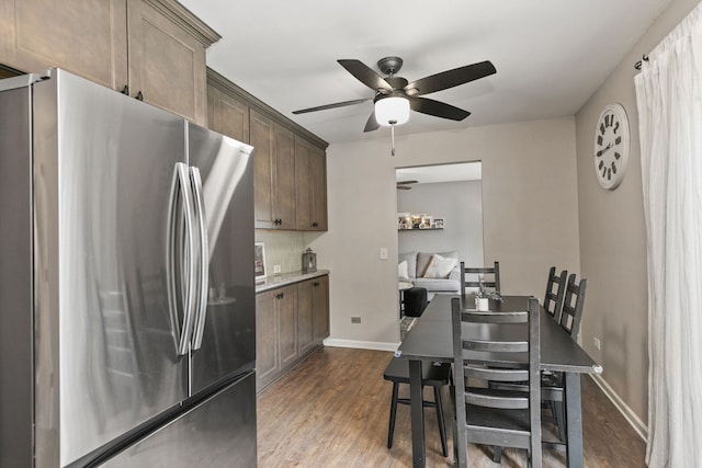 588 Arthur Dr, Cary, IL 60013 - dining room with ceiling fan and dark wood-style flooring