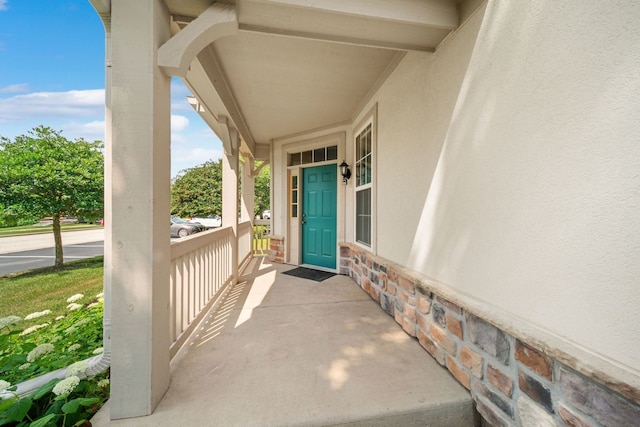 415 Bay Tree Cir, Vernon Hills, IL 60061 - doorway to property with a porch, stucco siding, and stone siding