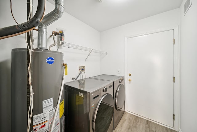 415 Bay Tree Cir, Vernon Hills, IL 60061 - laundry room with washing machine and dryer, water heater, and wood finished floors