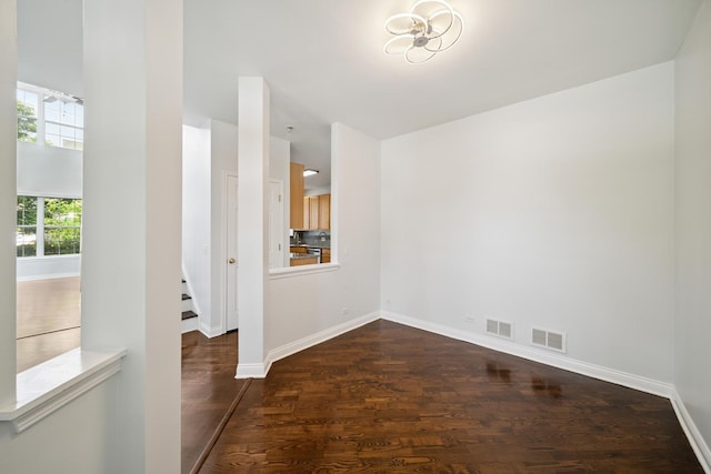 415 Bay Tree Cir, Vernon Hills, IL 60061 - spare room featuring dark wood-type flooring and baseboards