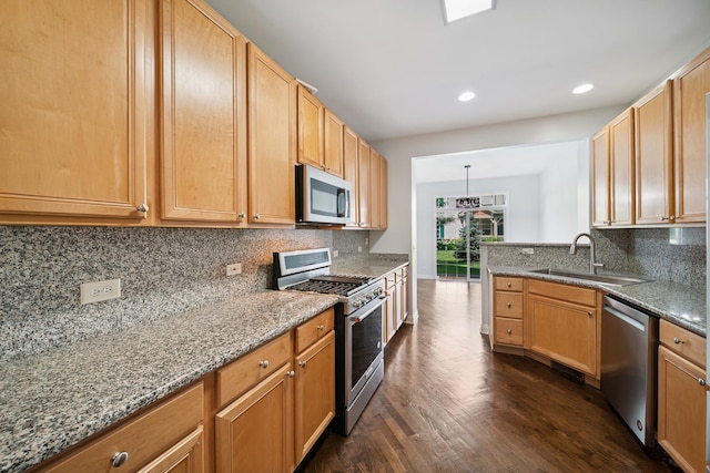 415 Bay Tree Cir, Vernon Hills, IL 60061 - kitchen featuring appliances with stainless steel finishes, dark wood finished floors, light stone counters, tasteful backsplash, and recessed lighting