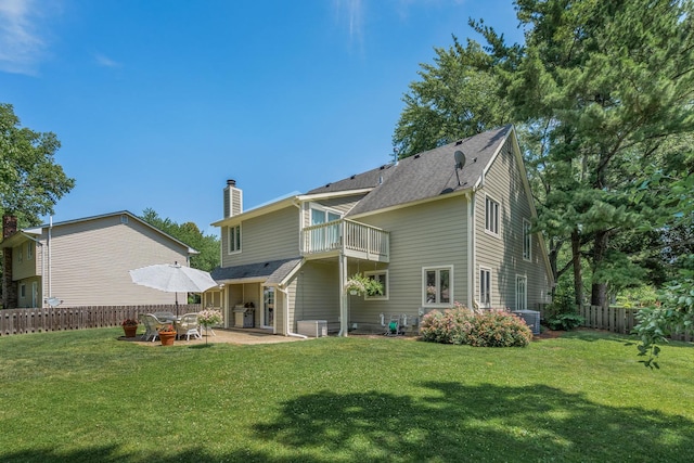 2 Cedar Gate Cir, Sugar Grove, IL 60554 - rear view of house with a chimney, a balcony, a patio, and roof with shingles