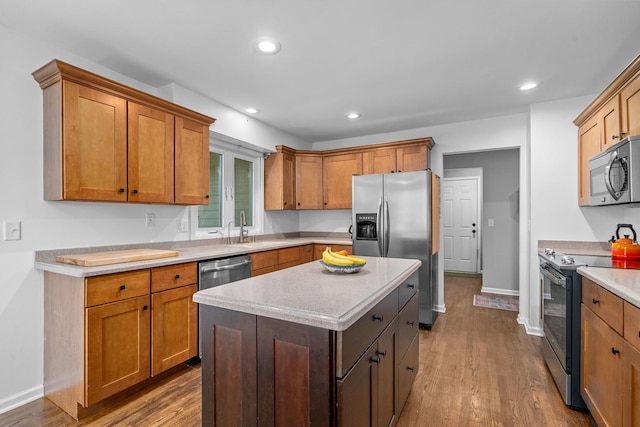 2 Cedar Gate Cir, Sugar Grove, IL 60554 - kitchen featuring stainless steel appliances, wood finished floors, light countertops, recessed lighting, and brown cabinetry