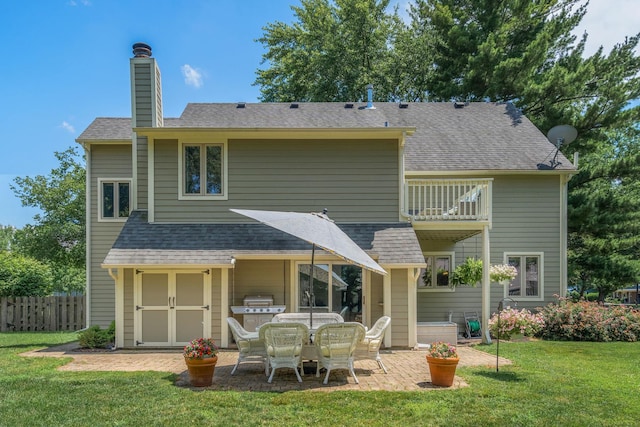 2 Cedar Gate Cir, Sugar Grove, IL 60554 - rear view of house featuring a balcony, a patio, a chimney, and roof with shingles