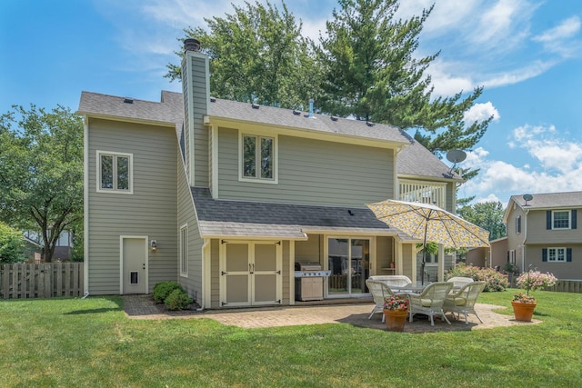 2 Cedar Gate Cir, Sugar Grove, IL 60554 - back of house featuring a patio, a chimney, and roof with shingles