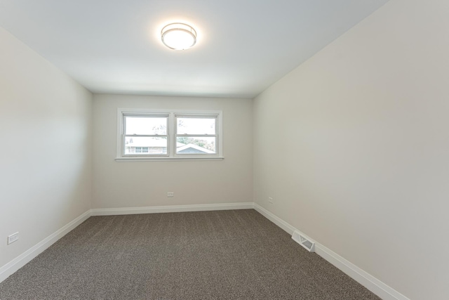 15709 Maryland Ave, Dolton, IL 60419 - empty room with carpet floors and baseboards