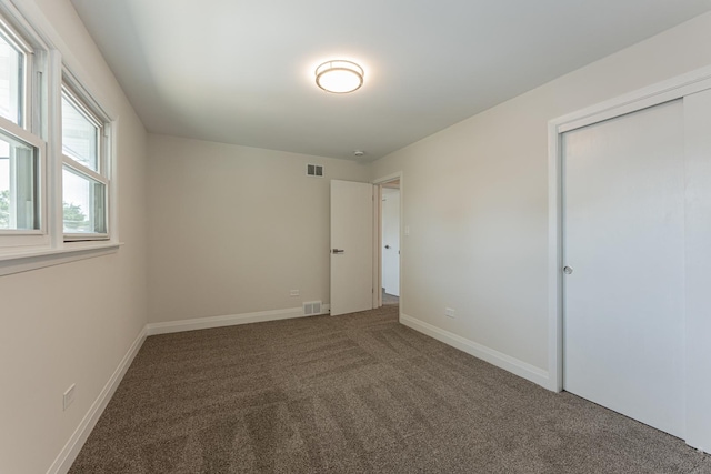 15709 Maryland Ave, Dolton, IL 60419 - unfurnished bedroom with carpet flooring and a closet