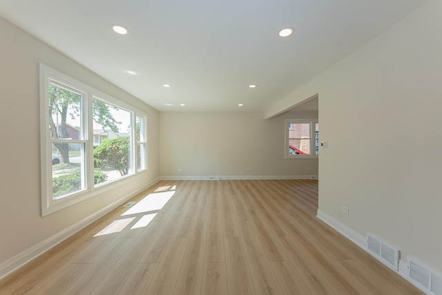 15709 Maryland Ave, Dolton, IL 60419 - unfurnished living room with healthy amount of natural light, light wood-style flooring, and recessed lighting