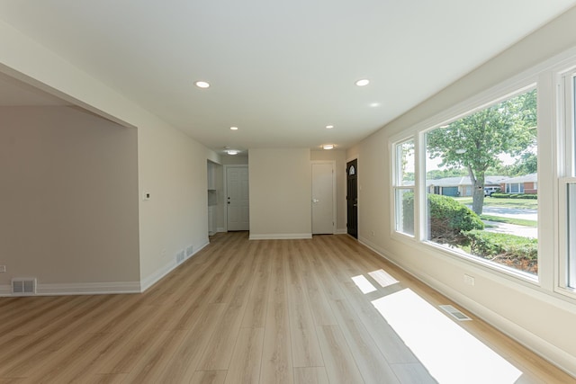 15709 Maryland Ave, Dolton, IL 60419 - unfurnished living room featuring plenty of natural light, light wood-style flooring, and recessed lighting