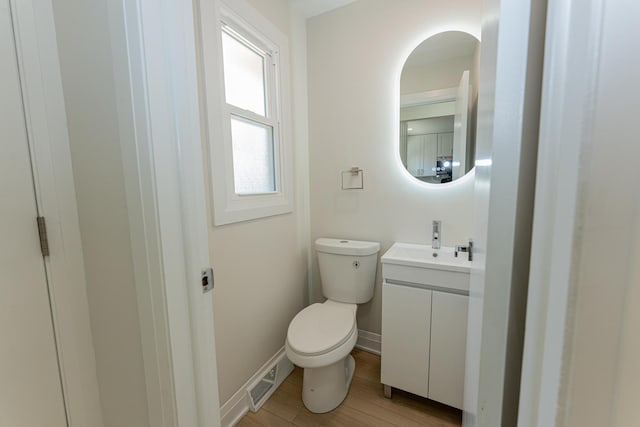 15709 Maryland Ave, Dolton, IL 60419 - half bathroom with vanity and wood finished floors