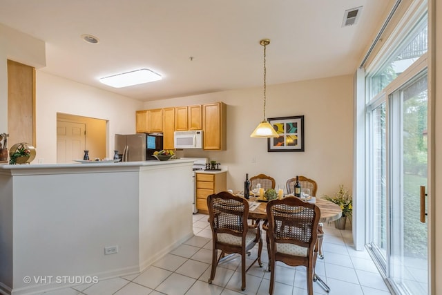 976 Enfield Dr, Northbrook, IL 60062 - kitchen featuring white appliances, pendant lighting, light tile patterned floors, a peninsula, and light brown cabinets