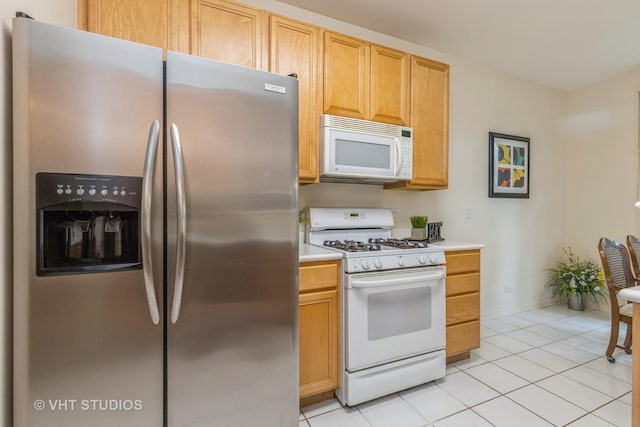 976 Enfield Dr, Northbrook, IL 60062 - kitchen with white appliances, light tile patterned floors, and light countertops