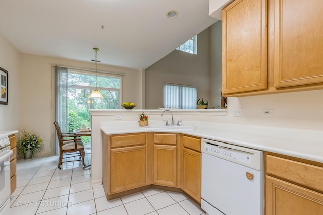 976 Enfield Dr, Northbrook, IL 60062 - kitchen with dishwasher, light countertops, light tile patterned floors, a peninsula, and lofted ceiling