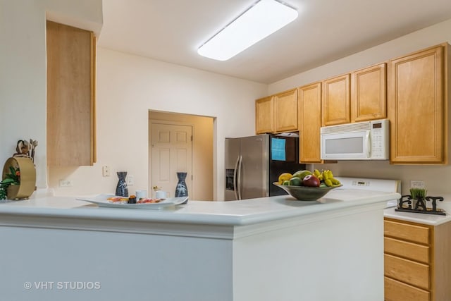 976 Enfield Dr, Northbrook, IL 60062 - kitchen featuring white microwave, stainless steel refrigerator with ice dispenser, a peninsula, light countertops, and light brown cabinets