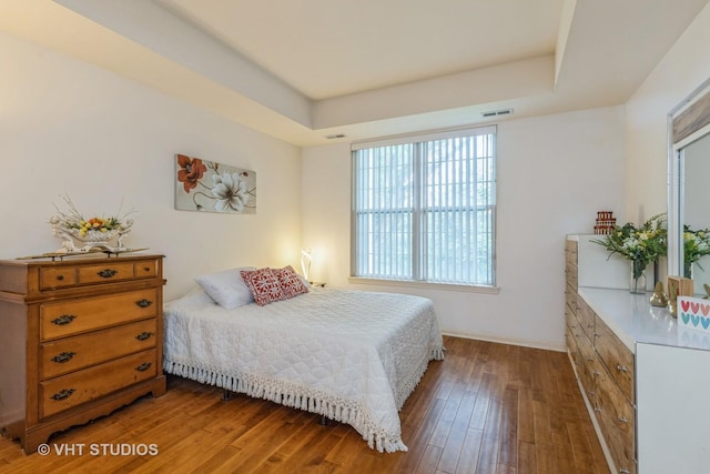 976 Enfield Dr, Northbrook, IL 60062 - bedroom with a tray ceiling and hardwood / wood-style flooring