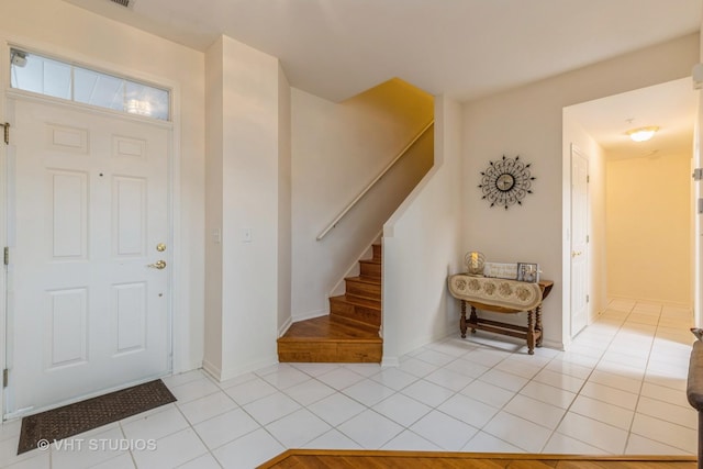 976 Enfield Dr, Northbrook, IL 60062 - foyer with light tile patterned floors and stairs