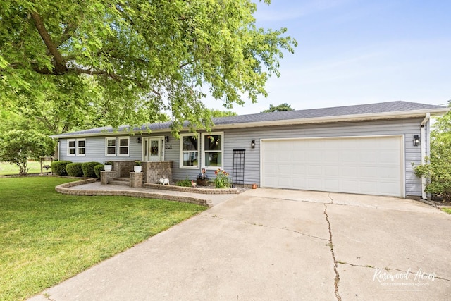 601 E Washington St, Ashkum, IL 60911 - ranch-style home with driveway, a front yard, and a garage