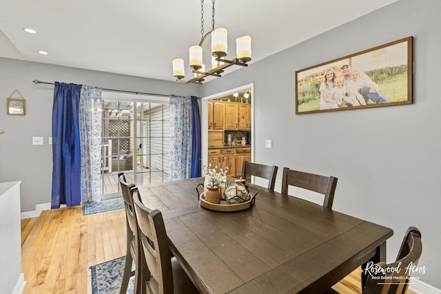 601 E Washington St, Ashkum, IL 60911 - dining area featuring a chandelier, light wood-style flooring, and recessed lighting
