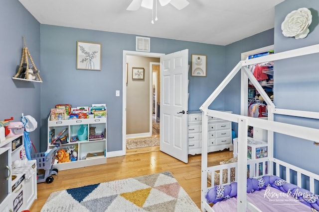 601 E Washington St, Ashkum, IL 60911 - bedroom with wood finished floors and a ceiling fan
