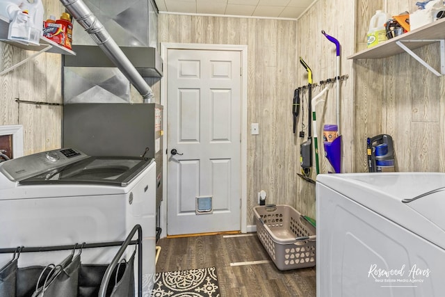 601 E Washington St, Ashkum, IL 60911 - washroom with independent washer and dryer, wooden walls, and dark wood-type flooring