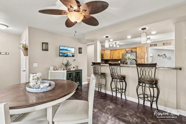 601 E Washington St, Ashkum, IL 60911 - dining space with a ceiling fan and baseboards