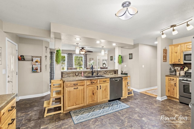 601 E Washington St, Ashkum, IL 60911 - kitchen with appliances with stainless steel finishes, light brown cabinets, ceiling fan, and tasteful backsplash