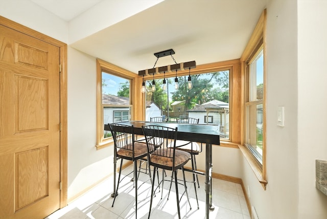 10105 S California Ave, Chicago, IL 60655 - dining room featuring baseboards and light tile patterned flooring