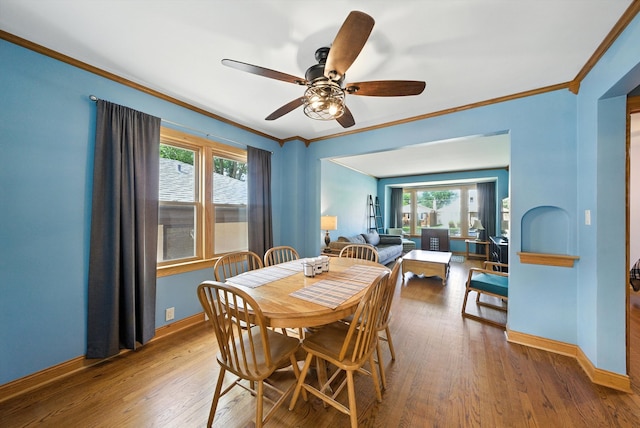 10105 S California Ave, Chicago, IL 60655 - dining space featuring healthy amount of natural light, ornamental molding, ceiling fan, and wood finished floors