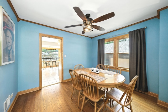 10105 S California Ave, Chicago, IL 60655 - dining space featuring crown molding, light wood-style flooring, and a ceiling fan