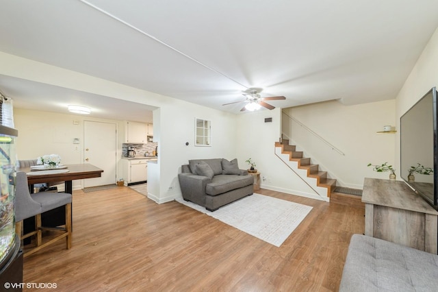 6265 Gold Cir Unit 6265, Hanover Park, IL 60133 - living area featuring stairway, light wood-style flooring, and a ceiling fan