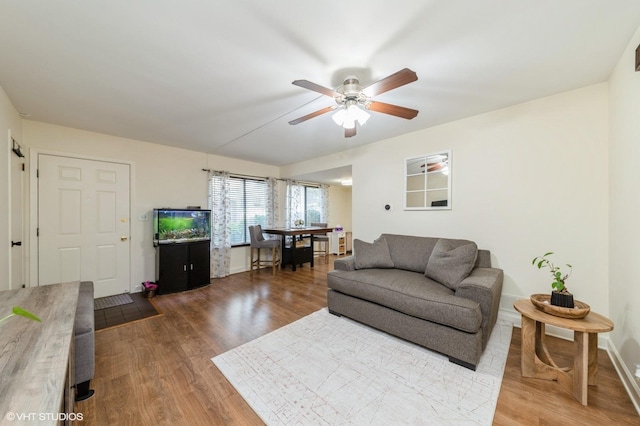 6265 Gold Cir Unit 6265, Hanover Park, IL 60133 - living area featuring ceiling fan and wood finished floors