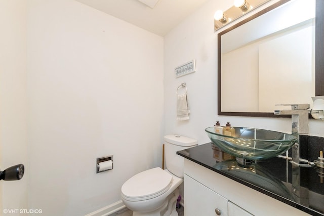6265 Gold Cir Unit 6265, Hanover Park, IL 60133 - half bathroom featuring vanity and toilet