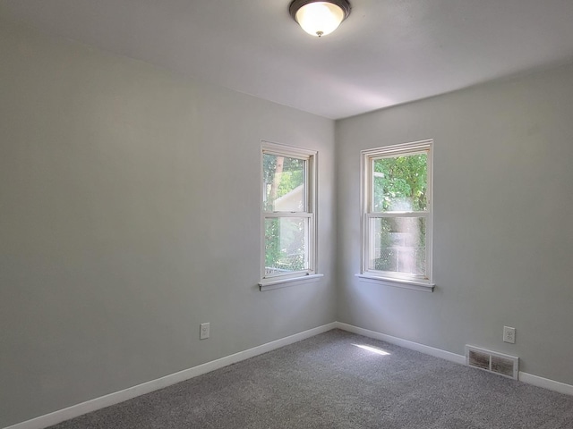 2928 Ridgeway Ave, Rockford, IL 61101 - carpeted empty room with baseboards